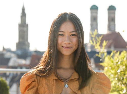 Munich for expats: This Asian woman is left smiling by the beautiful city.